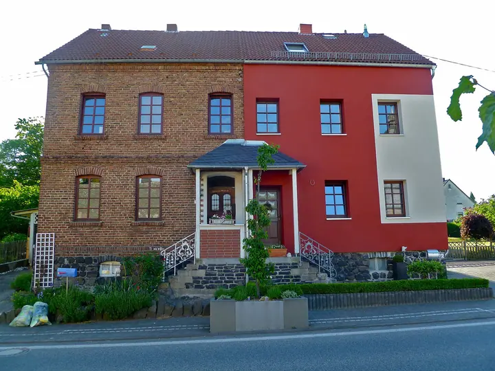 Houses with exterior insulation finish system partly applied