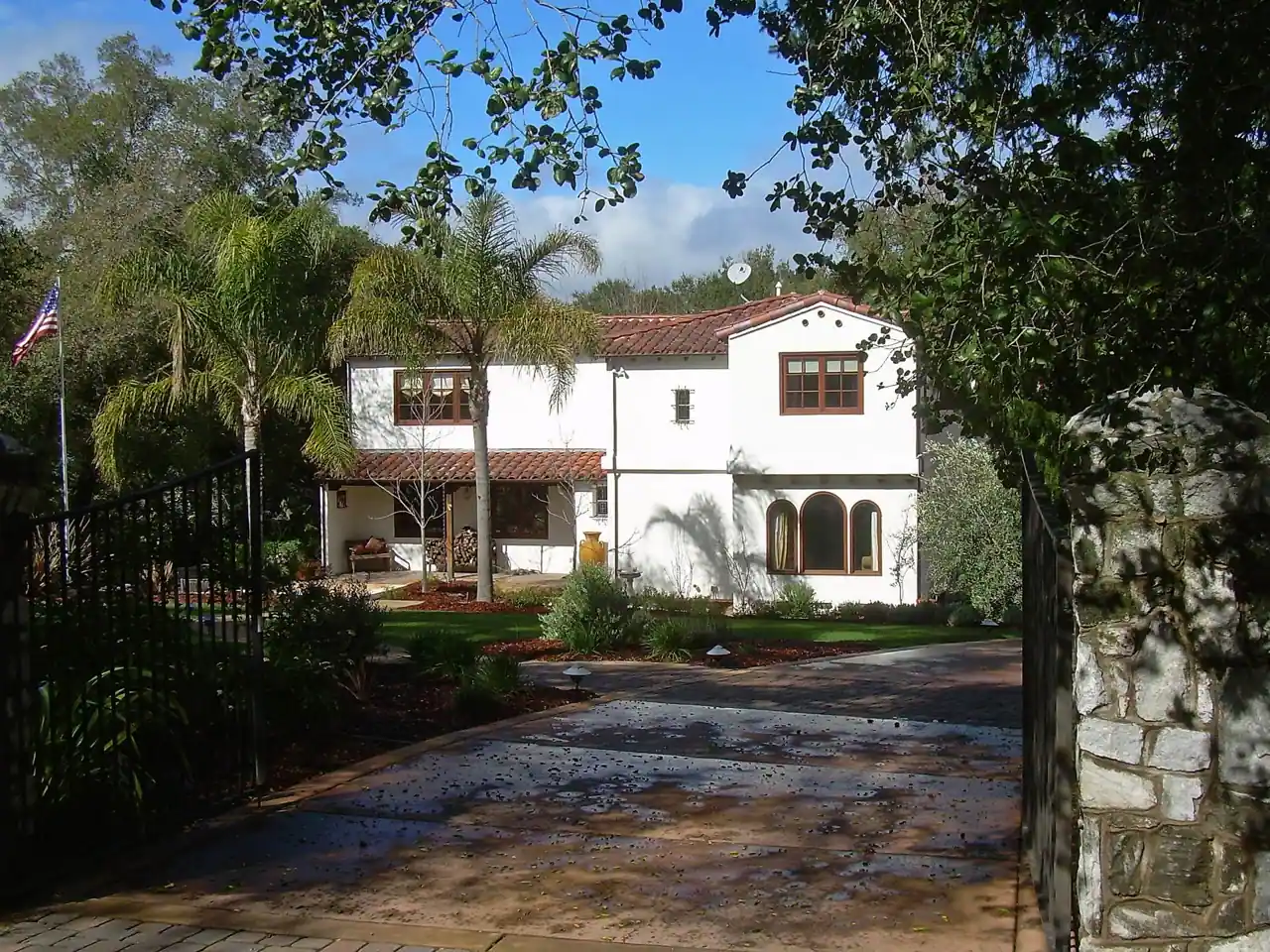Stucco home with clay tile roof